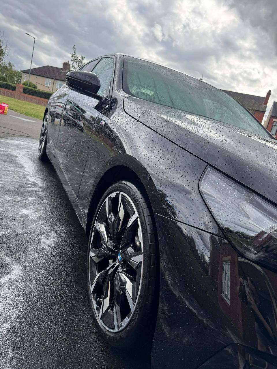 Black BMW with glossy sealed paintwork after an exterior detail